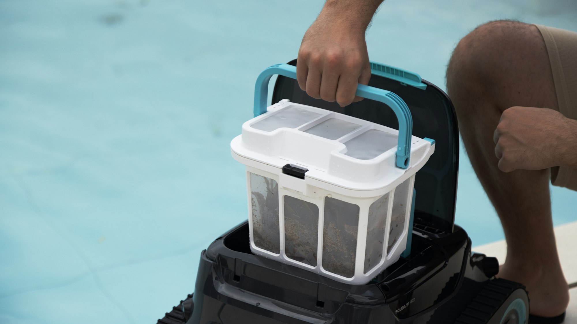 Pool filter cartridge being cleaned