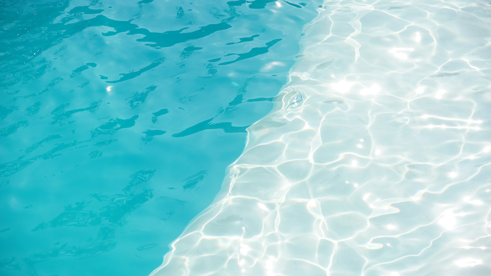 Clear, sparkling blue swimming pool water